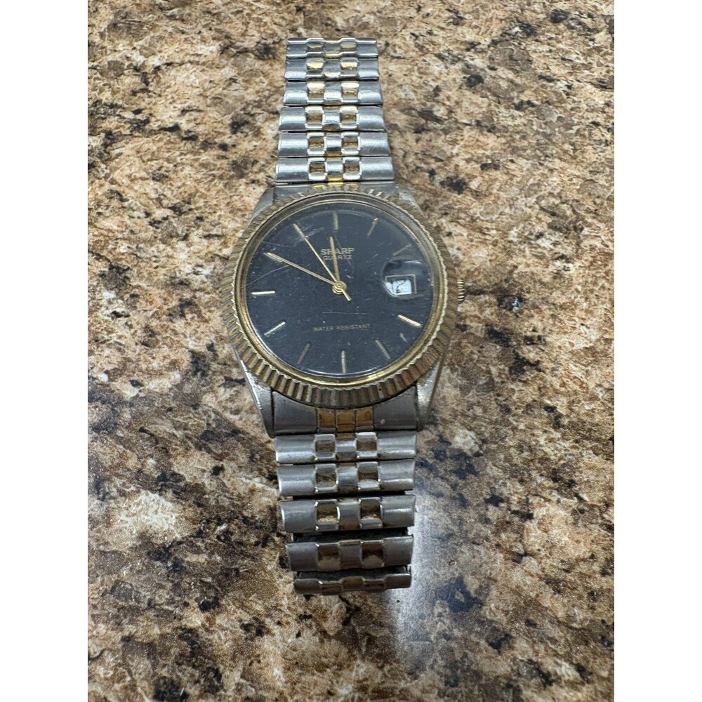 Vintage Sharp Quartz Watch Gold Tone Fluted Bezel Black Dial Date Stretch Band